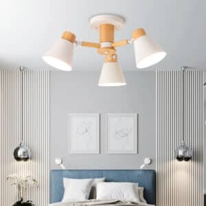 Suspension Bois LED au Design Nordique à Trois Têtes dans une chambre avec un lit